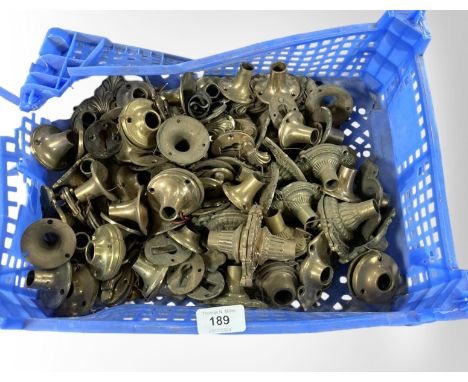 A crate of vintage brass door handle collars and fittings 