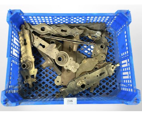 A crate of vintage brass door plates 