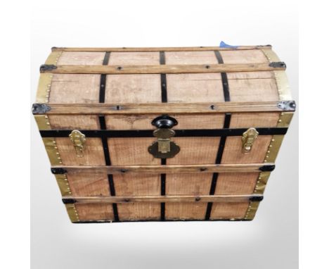 An early 20th century metal wooden and canvas bound domed topped trunk, width 76 cm 
