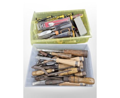 Two plastic trays containing masonry and carpentry chisels and other tools.