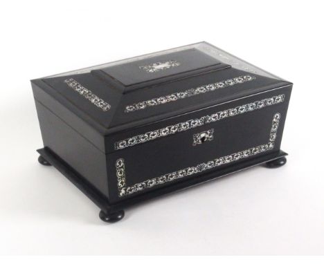 An ebonised sarcophagal form sewing box inlaid with cut mother of pearl, circa 1860, raised on four bun feet, the front and l