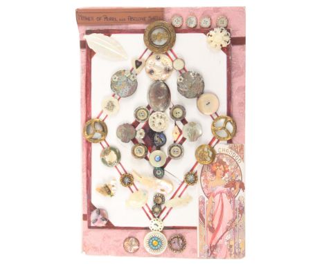 A display of forty five mother of pearl and abalone shell buttons, including a good pair of floral and engraved examples and 