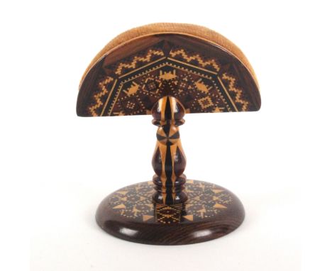 A rosewood Tunbridge ware ring stand and pin cushion, the fan form pin cushion in geometric mosaic over a stick ware stem wit