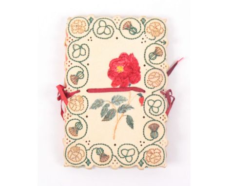 An embroidered card needle book, each cover painted with a botanical water colour within an embroidered border of shamrocks, 