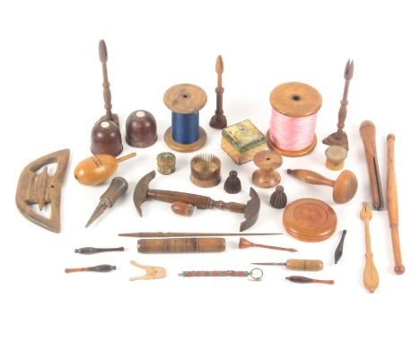 A mixed lot - mostly wooden sewing and crafts tools, comprising various bobbins, hat stretcher, large reels, boxwood circular