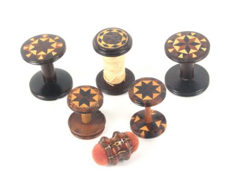Tunbridge ware - six pieces, comprising a pair of rosewood reels with circular stick ware tops, 3cms dia., three single reels