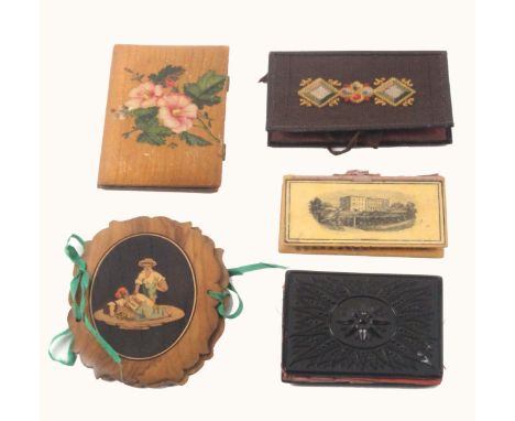 Five needle books, comprising an olive wood Sorrento example of shaped oval form one side inlaid with an oval panel of a rest