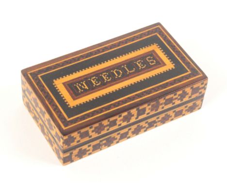 A Tunbridge ware rectangular box, the lid with a mosaic panel 'Needles' within mosaic borders, the sides with bands of mosaic