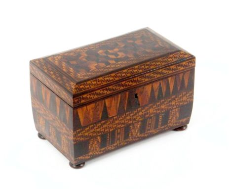 An unusual and intensely decorated Tunbridge ware tea caddy, of sarcophagol form raised on bun feet, the canted top with a pa