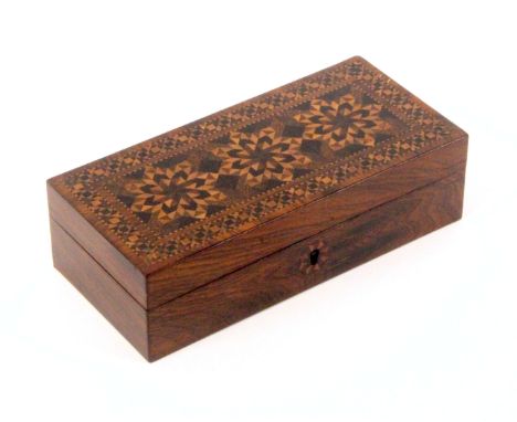 An attractive Tunbridge ware rosewood desk box, of rectangular form, the hinged lid with three star form stick ware panels wi