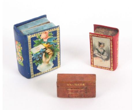 Three needle packet boxes, comprising a gilt tooled red leather book form example, the lid with female colour print, the inte