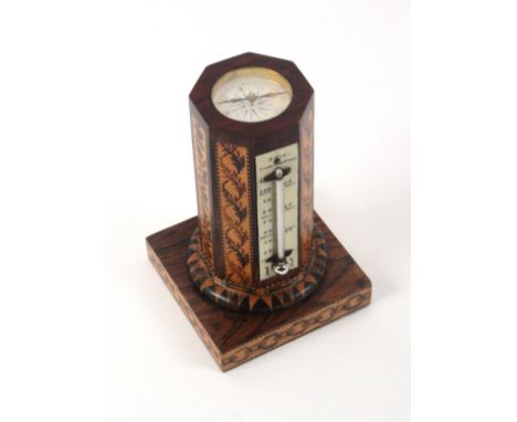 A Tunbridge ware combination desk thermometer/compass by Edmund Nye, the square rosewood base bordered by chain form mosaic a