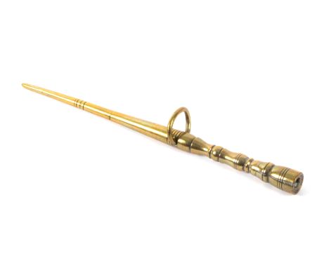 A brass knitting stick, of turned tapering form with brass loop mount, 18cms.                                                