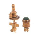 Two early painted Tunbridge ware white wood sewing clamps, comprising a floral and ring painted