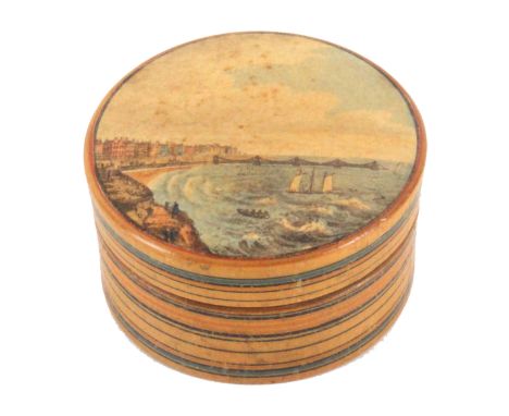 An early Tunbridge ware print and paint decorated circular box, the lid with a colour print depicting Brighton Chain Pier and