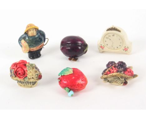 Six celluloid novelty tape measures, comprising a basket of flowers with ladybird tape end, 5cms, a plum with fly tape end, a