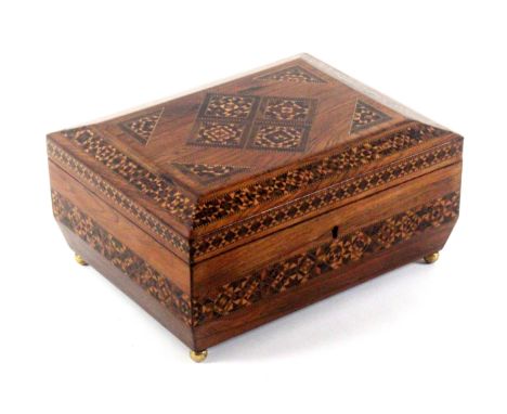 A rosewood Tunbridge ware sewing box of sarcophagol form, the sides with two bands of stick ware, the canted lid with four di
