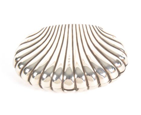 An unusual silver scallop shell form sewing etui, with press catch and hinged to reveal a blue velvet flush fitted interior, 