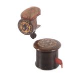 A Tunbridge ware rosewood counter tape measure and a sewing clamp, the large tape measure of rib