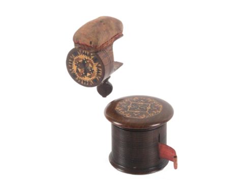 A Tunbridge ware rosewood counter tape measure and a sewing clamp, the large tape measure of rib turned cylinder form below a