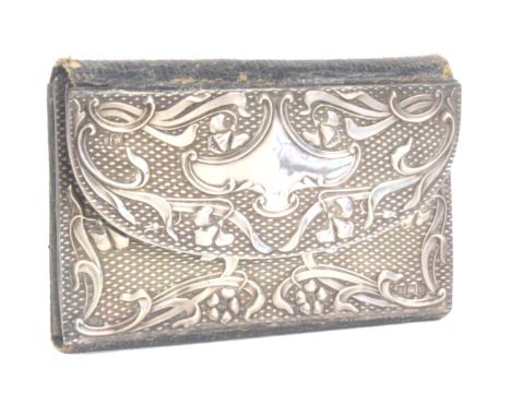 A silver mounted Art Nouveau style leather sewing wallet, the green leather interior with needle packets and three mother of 