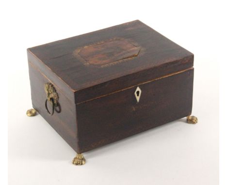 Two early 19th Century sewing boxes, comprising a sarcophagol form example in tulipwood the domed lid with an unidentified co