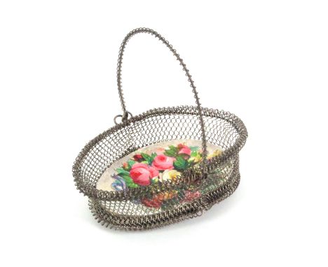 A 19th Century wire mesh miniature basket, with swing handle, the oval base with raised colour print of a bouquet of flowers 