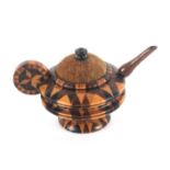 A Tunbridge stick ware pin cushion and pin wheel in the form of a tea pot, velvet pad with turned
