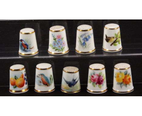 Royal Worcester black mark hand painted and signed porcelain thimbles, comprising an example painted with a swallow signed 'P