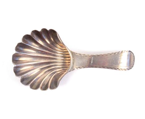 A scallop shell bowl, silver caddy spoon, the handle initialled 'SJ' London, 1788, by Hester Bateman, 8cms.                  