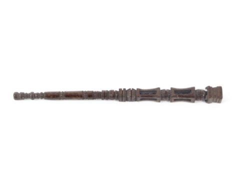 A continental carved wood knitting stick, the square aperture mount above a ball and two lanterns each with two balls to a ch