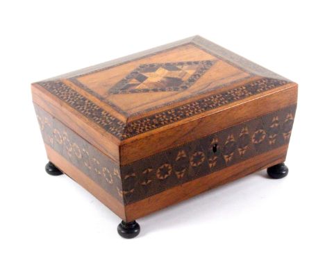 A rosewood Tunbridge ware sewing box of sarcophagol form, the sides with a broad band of stick ware, the canted lid with a bo