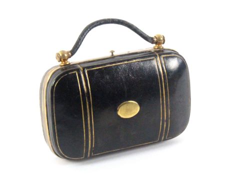 A leather and gilt brass mounted sewing companion in the form of a bag, circa 1890, of rounded corner rectangular form with s