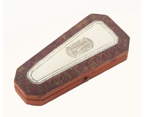 A French etui of tapering form covered in tooled leather, the lid with a white lac panel inscribed 'Souvenir', circa 1850, th