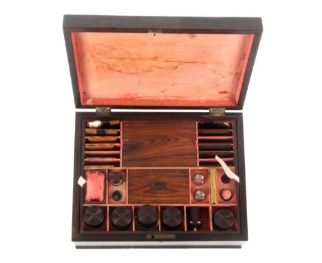 A well fitted rosewood rectangular sewing box, circa 1840, the base and top with bobbin turned mouldings. The pink paper comp