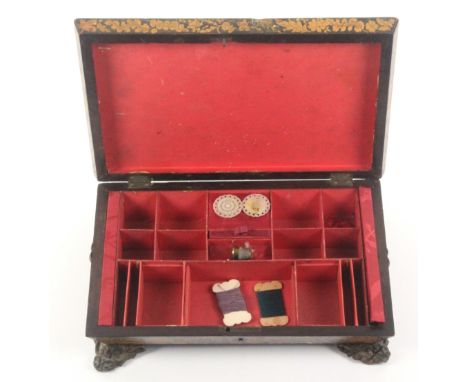 A Regency pen work sewing box of sarcophagol form, decorated with flowers and leafy scrolling branches and raised on elaborat