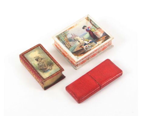 Two needle packet boxes and a lancet case, comprising a red leather gilt tooled book form needle packet box with colour print