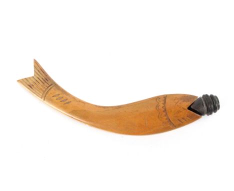 A continental box wood knitting stick, in the form of a fish, of curved form with carved details, its open mouth with turned 