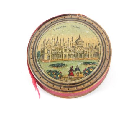 An early Tunbridge ware print and paint decorated disc form pin cushion, each domed side with titled colour print 'Brighton P