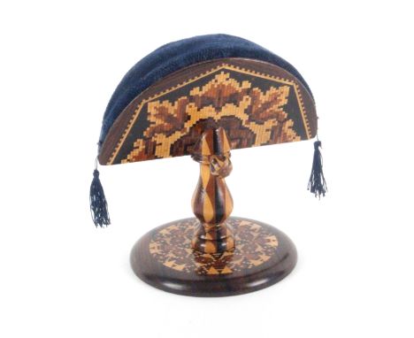 A rosewood Tunbridge ware ring stand and pin cushion, the fan form pin cushion in geometric mosaic over a stick ware stem wit