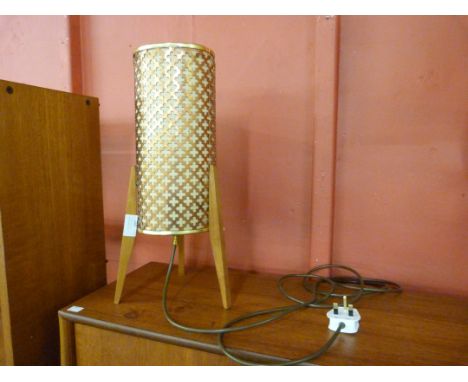 A small teak rocket lamp 