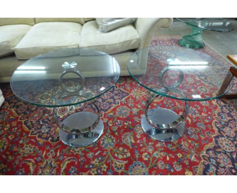 A pair of contemporary chrome and circular glass topped lamp tables 