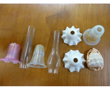 A collection of glass light shades, including four oil lamps, and two other metal lamps with coloured glass 