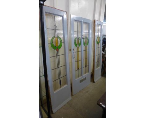 An Art Deco stained glass floor and matching porch windows 