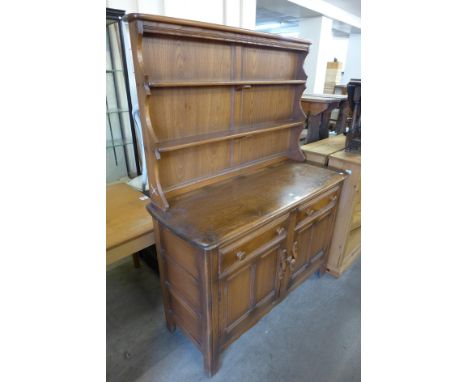 An Ercol Golden Dawn elm dresser 