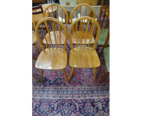 A set of four Ercol Blonde elm and beech Windsor chairs 