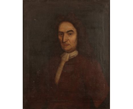 ENGLISH SCHOOL, 18TH CENTURY A portrait of a gentleman wearing a long wig, red jacket and lace jabot, depicted half-length in