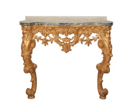 A LOUIS XV STYLE GILDED MAHOGANY CONSOLE TABLE, the later serpentine rectangular green and purple breccia marble top, above a