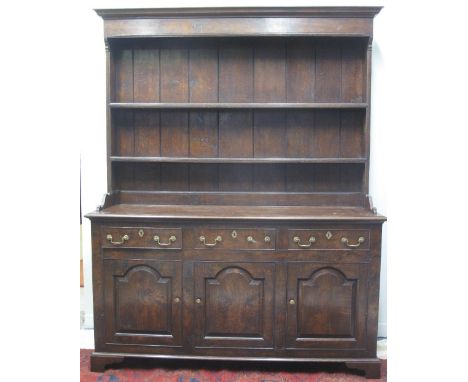 GOOD QUALITY 18TH CENTURY STYLE WELSH OAK DRESSER, having projecting moulded cornice over the boarded rack back with two shel