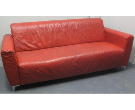 20TH CENTURY ITALIAN DESIGNER RED LEATHER SOFA on short chrome legs.  192 x 83 x 79cm.   CONDITION REPORT:  A little grubby b